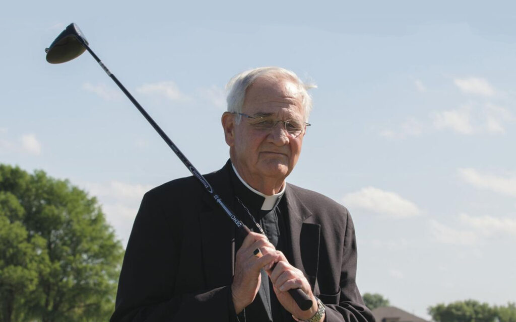 Priest with golf club