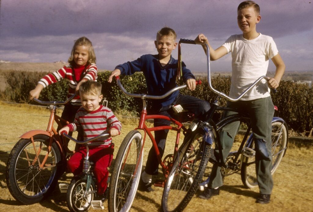 4 kids from the 1960s with their bikes