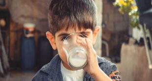 boy drinking glass of milk