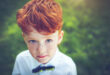 Red-headed boy with bow tie