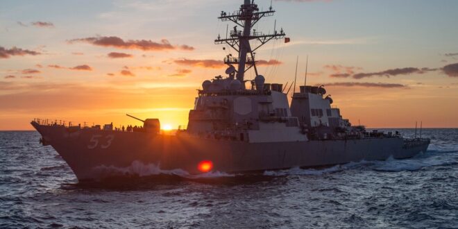 battleship at sunrise on the ocean