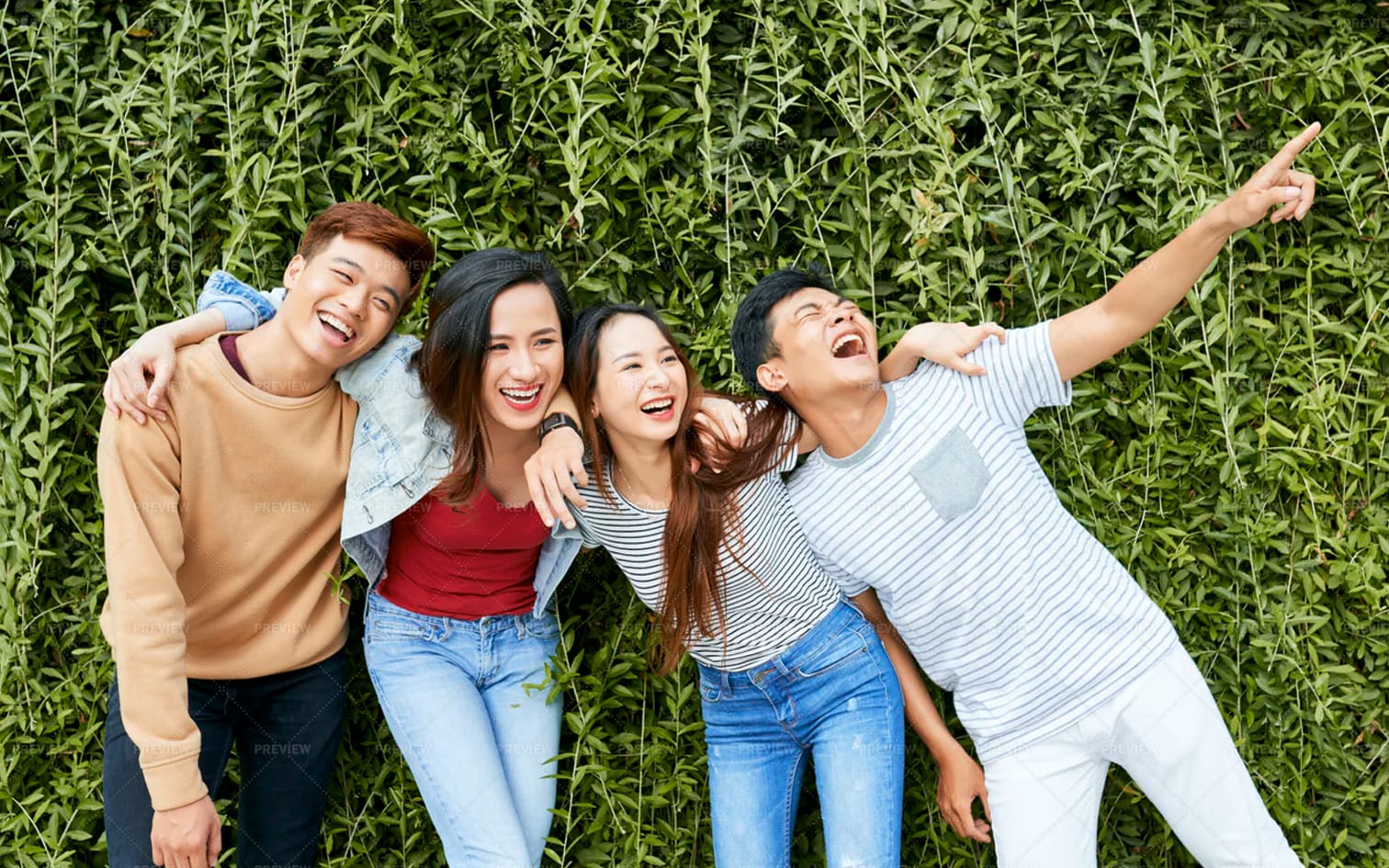four friends together laughing