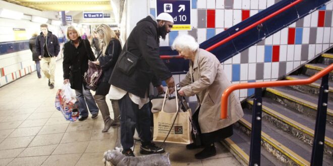 man helping elderly woman
