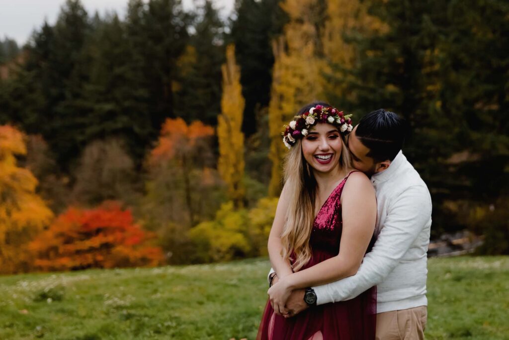 couple hugging in fall setting