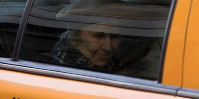 taxi with elderly woman passenger