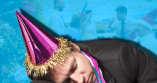 man in suit and party hat