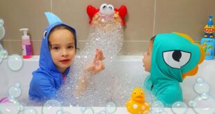 kids in a bath with toys