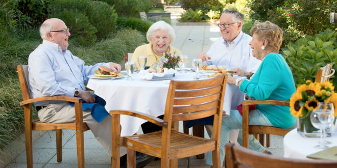 2 older couples laughing