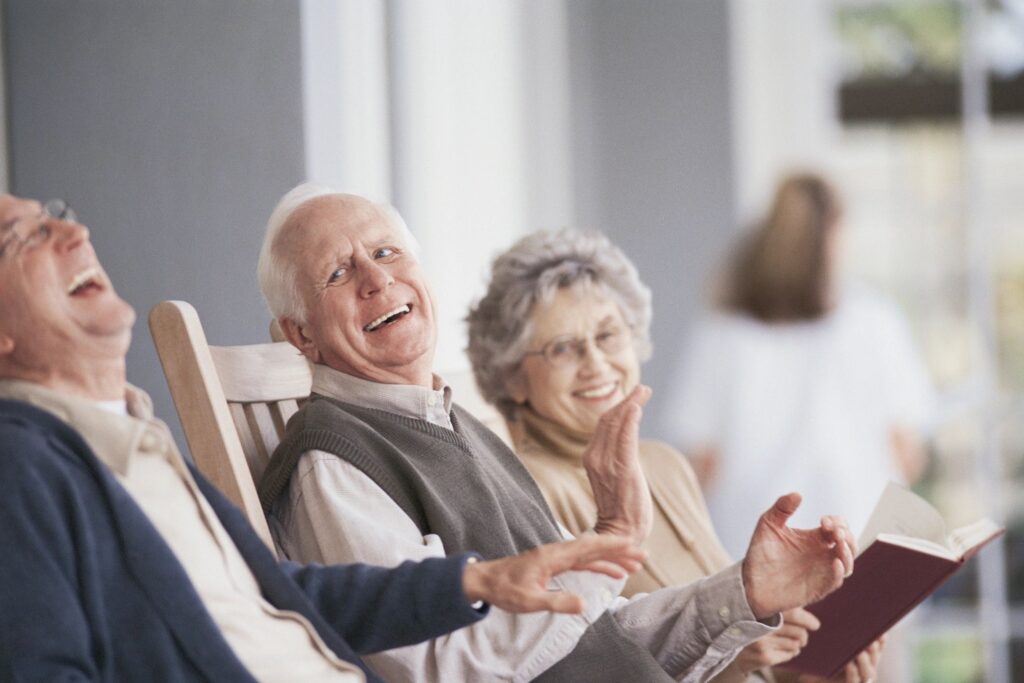 Elderly people laughing at funny stories