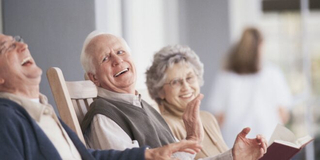 Elderly people laughing at funny stories
