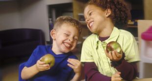 Two children laughing at funny stories