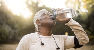 elderly man drinking water