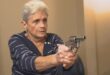 elderly lady with a hand gun