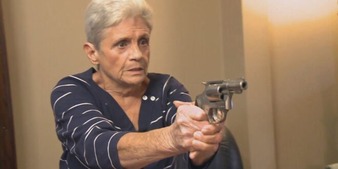 elderly lady with a hand gun