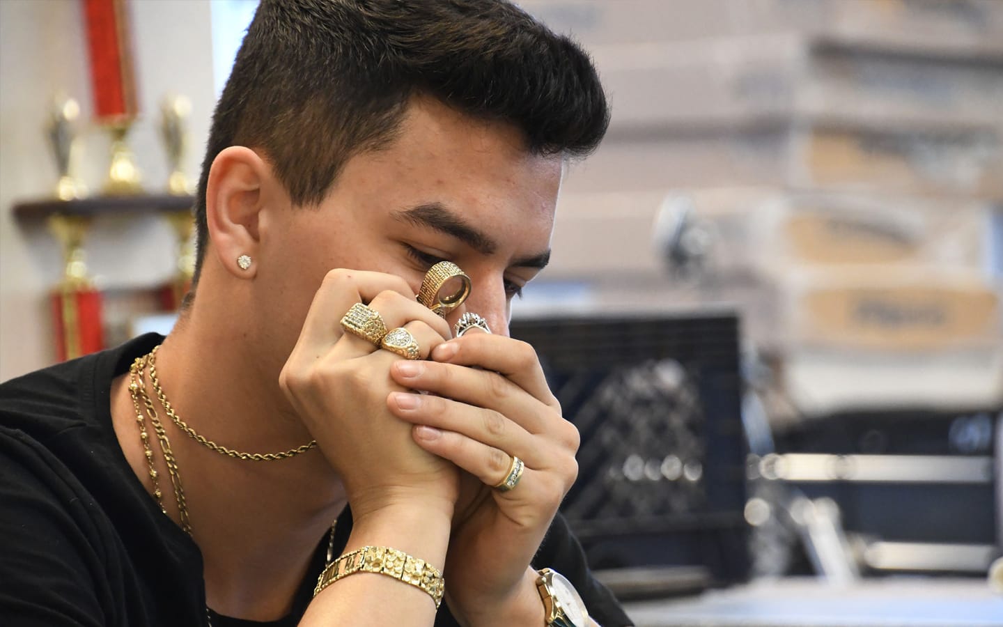 pawn broker looking at jewelry