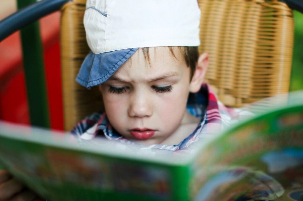 Boy reading funny stories